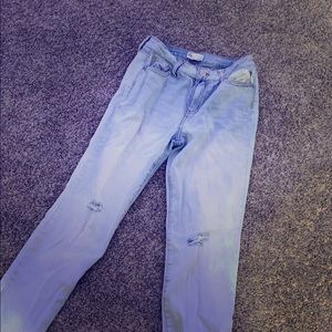 Washed out jeans with two smalls rips